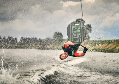 Ian Wilkinson GB knee boarder doing a somersault on the river Trent. Commercial sports photoshoot by Mark Wildsmith for www.wildsmith.photography. Ian Wilkinson GB knee boarder practicing on the river Trent in Nottinghamshire. Ian is a professional knee boarder. the athlete is captured upside down half way through a flip. the logo of 'Obrien' boards is clear to be seen in neon-green. Ian wilkinson is wearing a O'Brien life jacket. the water or spray in the shot is frozen in time. Mark Wildsmith Sheffield’s commercial food photographer at Wildsmith.photography in Sheffield. Ex Royal Navy chef with a history of fine dining. Now as a specialist food photographer bringing all his years of experience working in commercial kitchens.