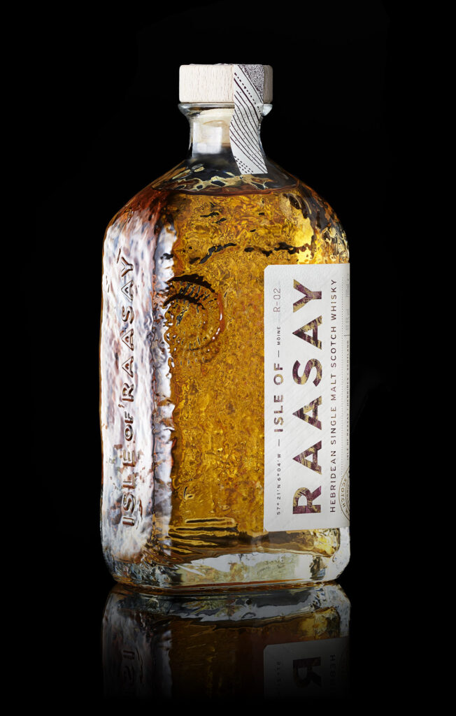 A bottle of Isle of Raasay whisky on black. Sheffield food photographer Mark Wildsmith. Photographed by Mark from Wildsmith Photography. Commercial food photographer and drink photographer based in London and Sheffield.