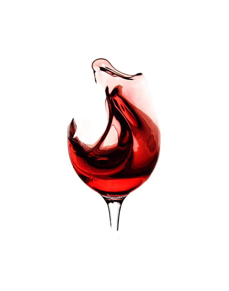 Wine spalsh in a glassless glass by Photographed by Mark from Wildsmith Photography. Commercial food photographer and drink photographer based in London and Sheffield.