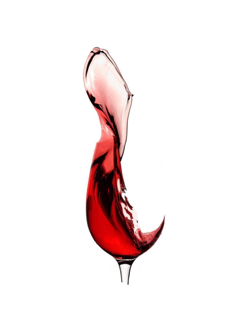 Wine spalsh in a glassless glass by Photographed by Mark from Wildsmith Photography. Commercial food photographer and drink photographer based in London and Sheffield.