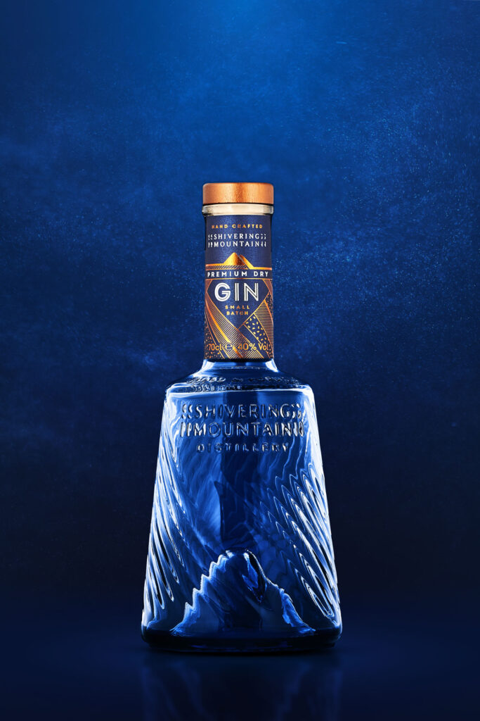 Shivering Mountain Gin shot on a Blue background. Sheffield award winning food and drink. Photographed by Mark from Wildsmith Photography. Commercial food photographer and drink photographer based in London and Sheffield.photographer Mark Wildsmith. Wildsmith photography is a food photographer near me